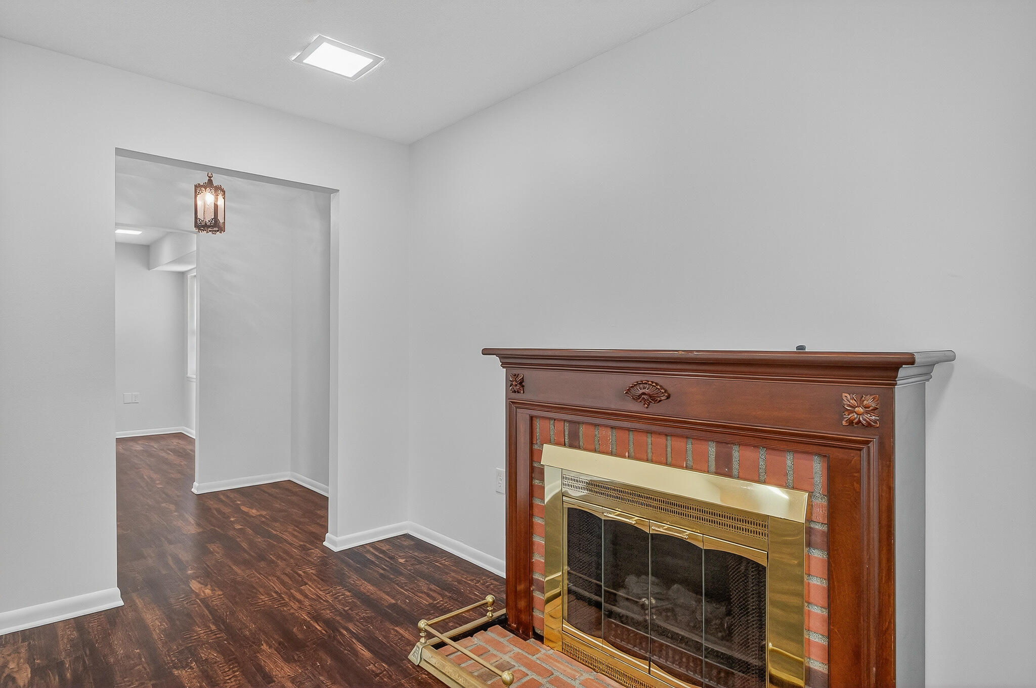 96 Yacht Club Drive, Unit 1 Fort Walton Beach, FL 32548 - Photo 9 of 43 a living room with a fireplace and a wooden floor