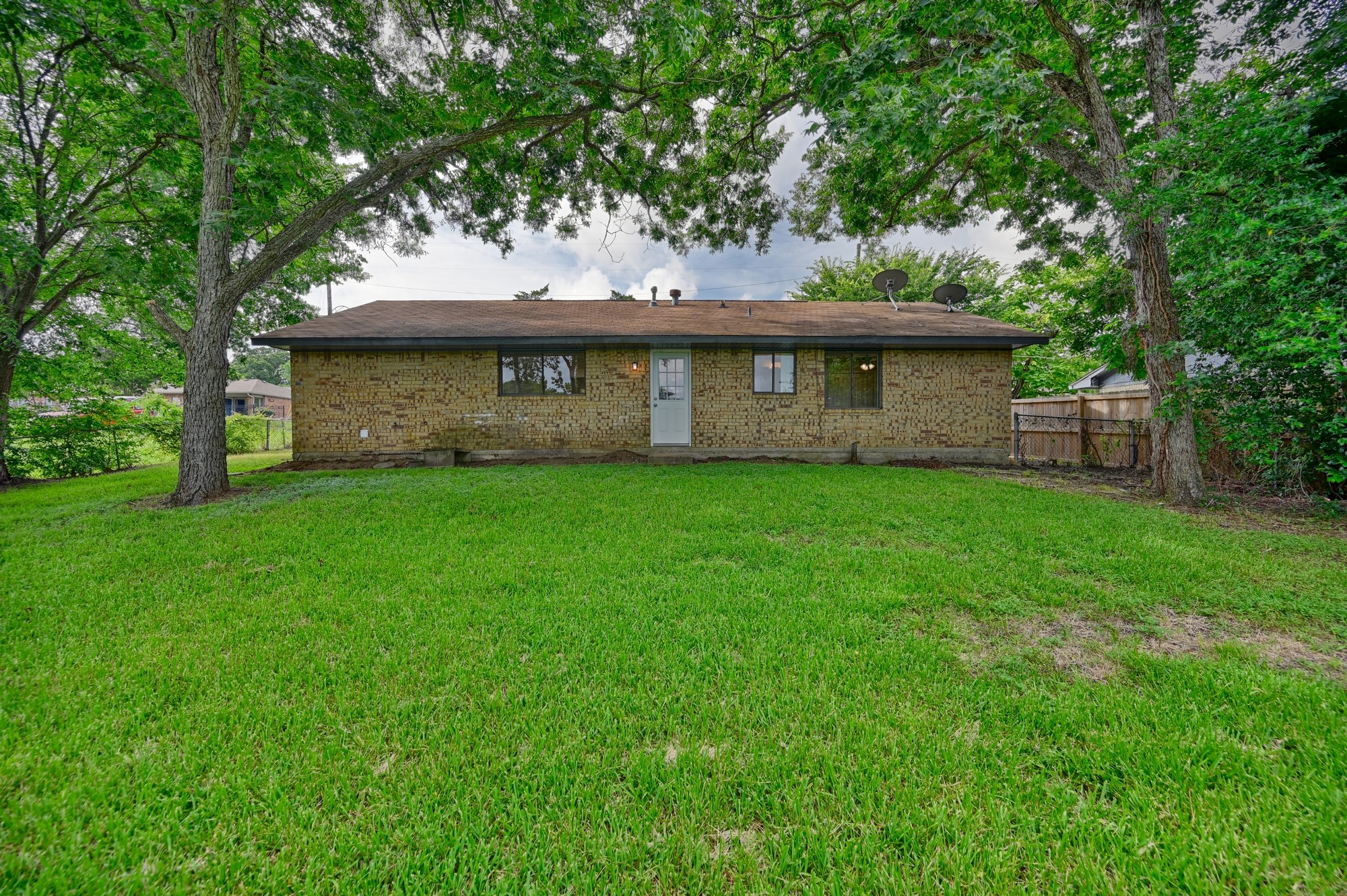 806 West Jefferson Street Brenham, TX 77833 - Photo 19 of 20 a view of a house with a garden