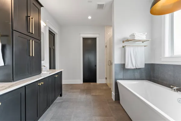 a bathroom with a bathtub and shower