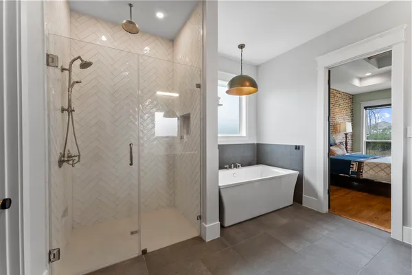 a bathroom with a tub and shower