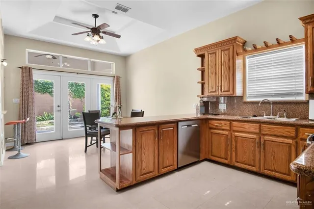 a very nice looking kitchen with a large window