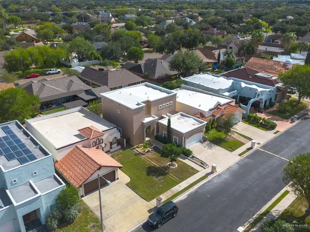 an aerial view of residential houses with outdoor space