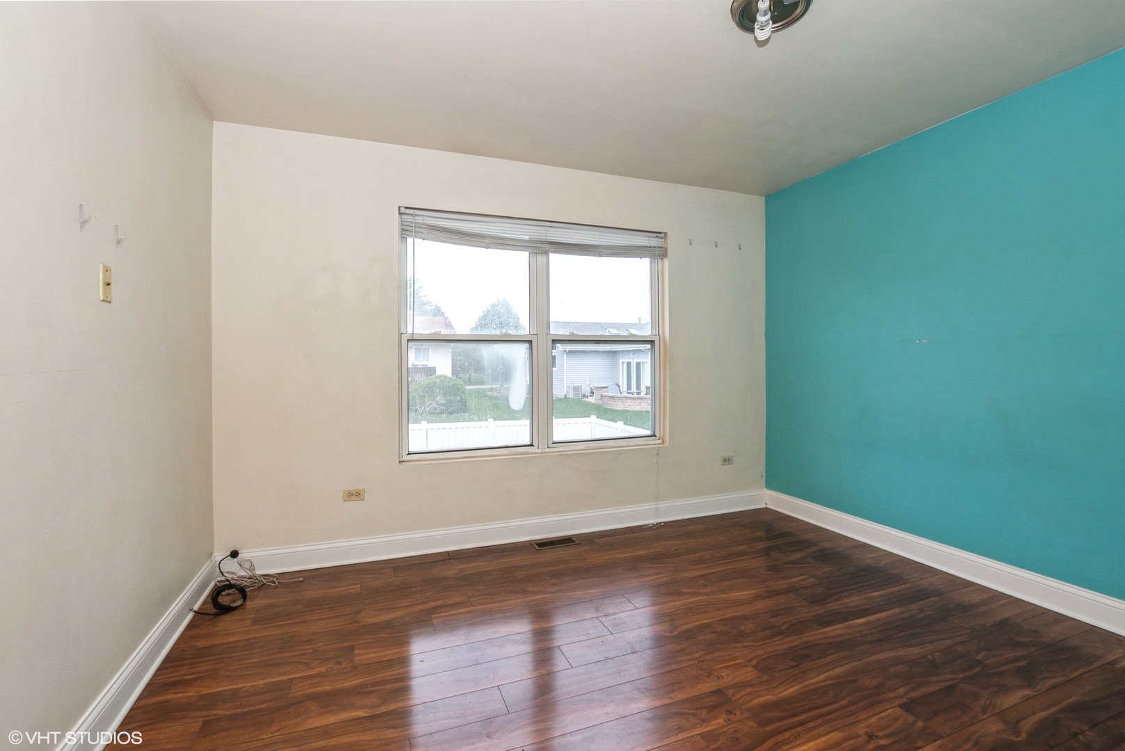 320 Danielle Road Matteson, IL 60443 - Photo 14 of 25 an empty room with wooden floor and windows