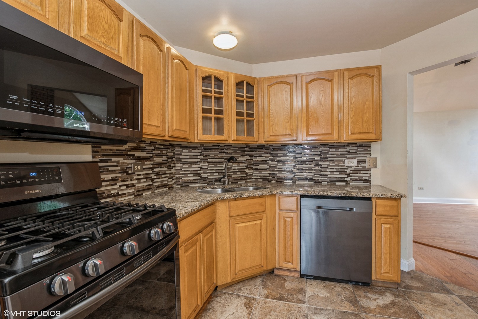 320 Danielle Road Matteson, IL 60443 - Photo 7 of 25 a kitchen with stainless steel appliances granite countertop a stove and a sink