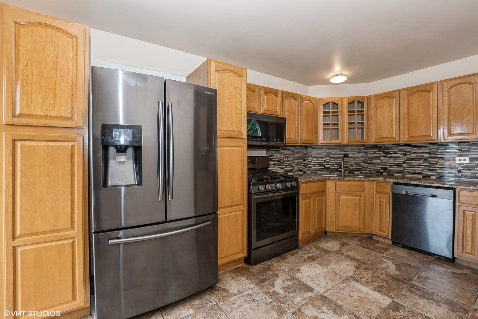 320 Danielle Road Matteson, IL 60443 - Photo 8 of 25 a kitchen with stainless steel appliances granite countertop a refrigerator and a stove top oven