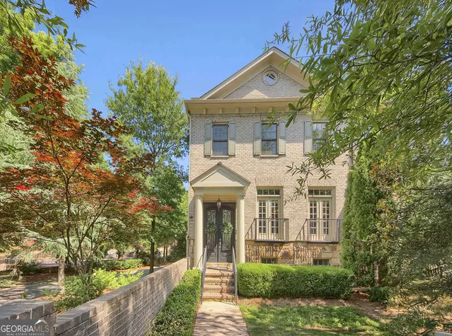 a front view of a house with garden