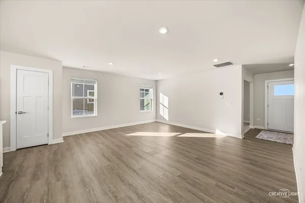 a living room with furniture rug and wooden floor