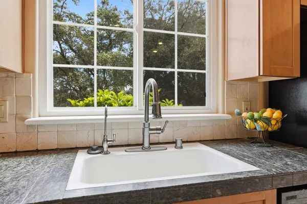 a bathroom with a double vanity sink a toilet and a mirror