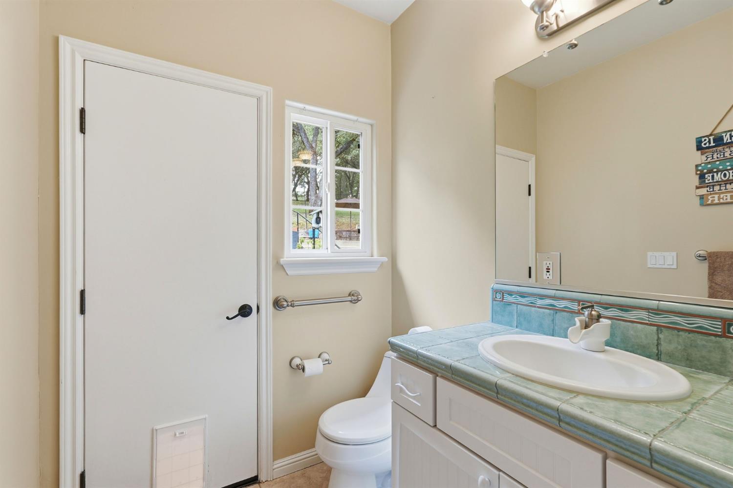 2030 Marden Drive Rescue, CA 95672 - Photo 52 of 96 a bathroom with a granite countertop sink toilet and shower