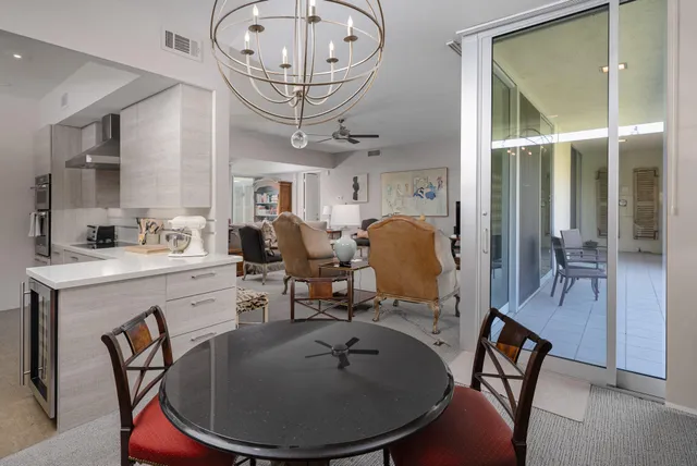 a kitchen with sink a stove and cabinets