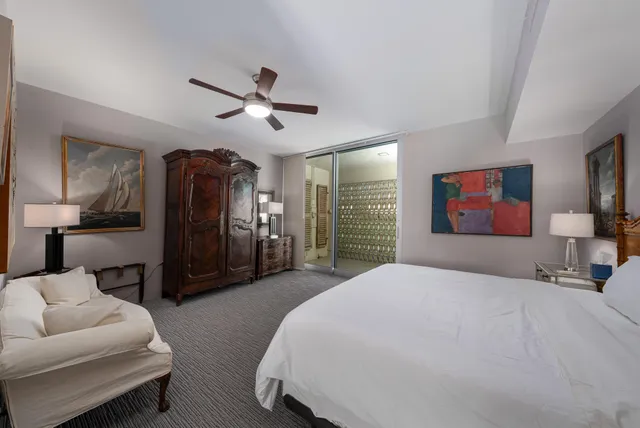 a bedroom with a bed and a view of walk in closet