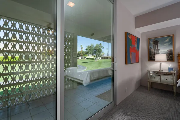 a view of a bathroom from a hallway