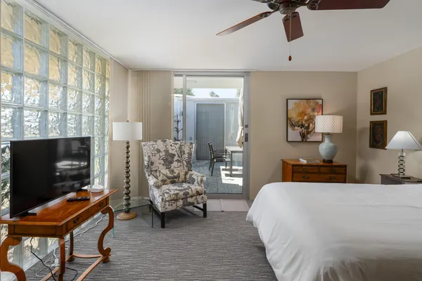 a bedroom with a bed and furniture