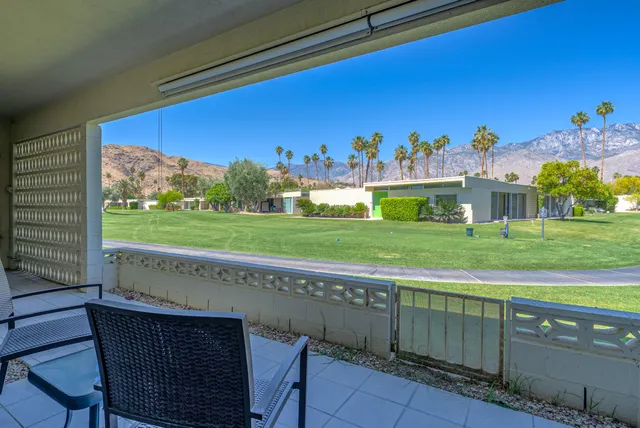 a swimming pool with outdoor seating