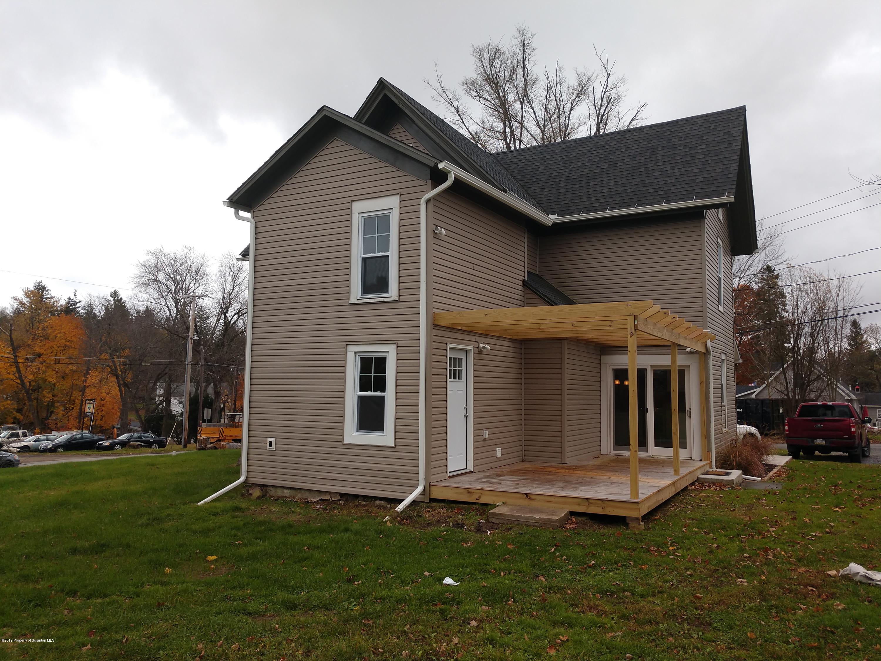 4373 State Rte 2014 Forest City, PA 18421 - Photo 5 of 32 a front view of a house with a garden and yard