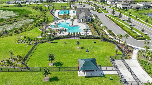 an aerial view of a house with outdoor seating