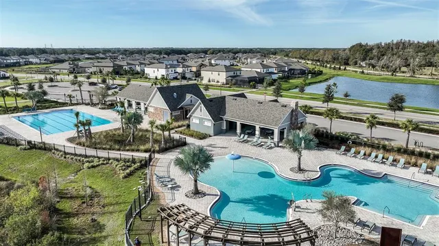 a view of a swimming pool with a patio