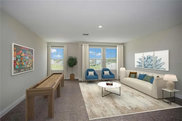 a living room with furniture and a large window