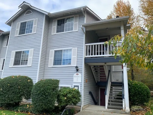 a view of a house with a window and stairs