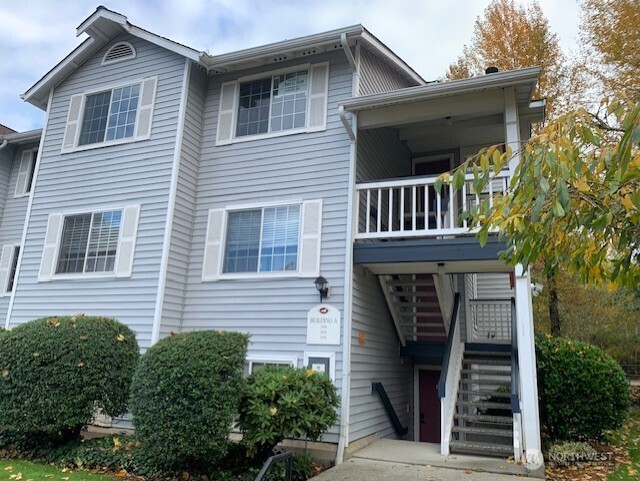 a view of a house with a window and stairs