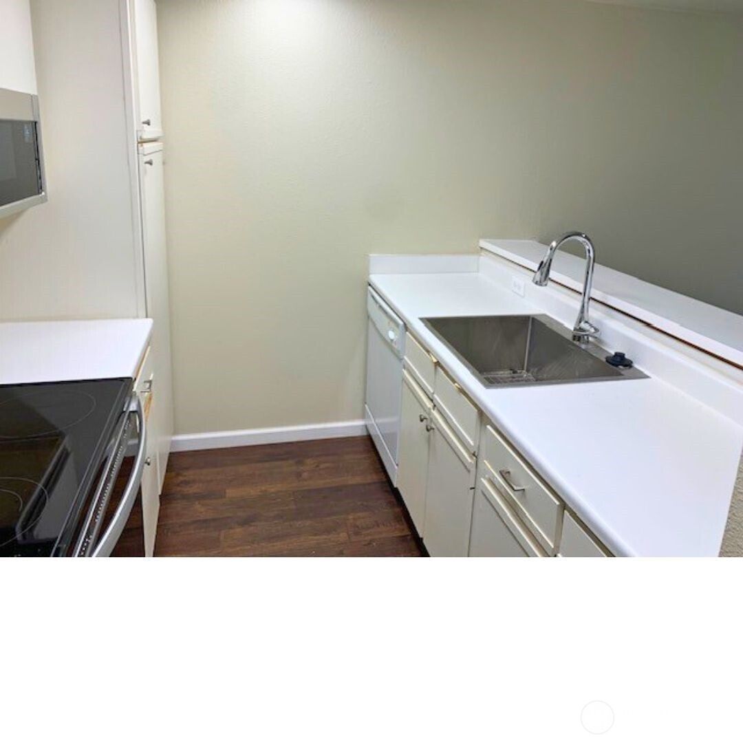 7453 Newcastle Golf Club Road, Unit A304 Newcastle, WA 98059 - Photo 11 of 19 a bathroom with a sink a vanity and mirror