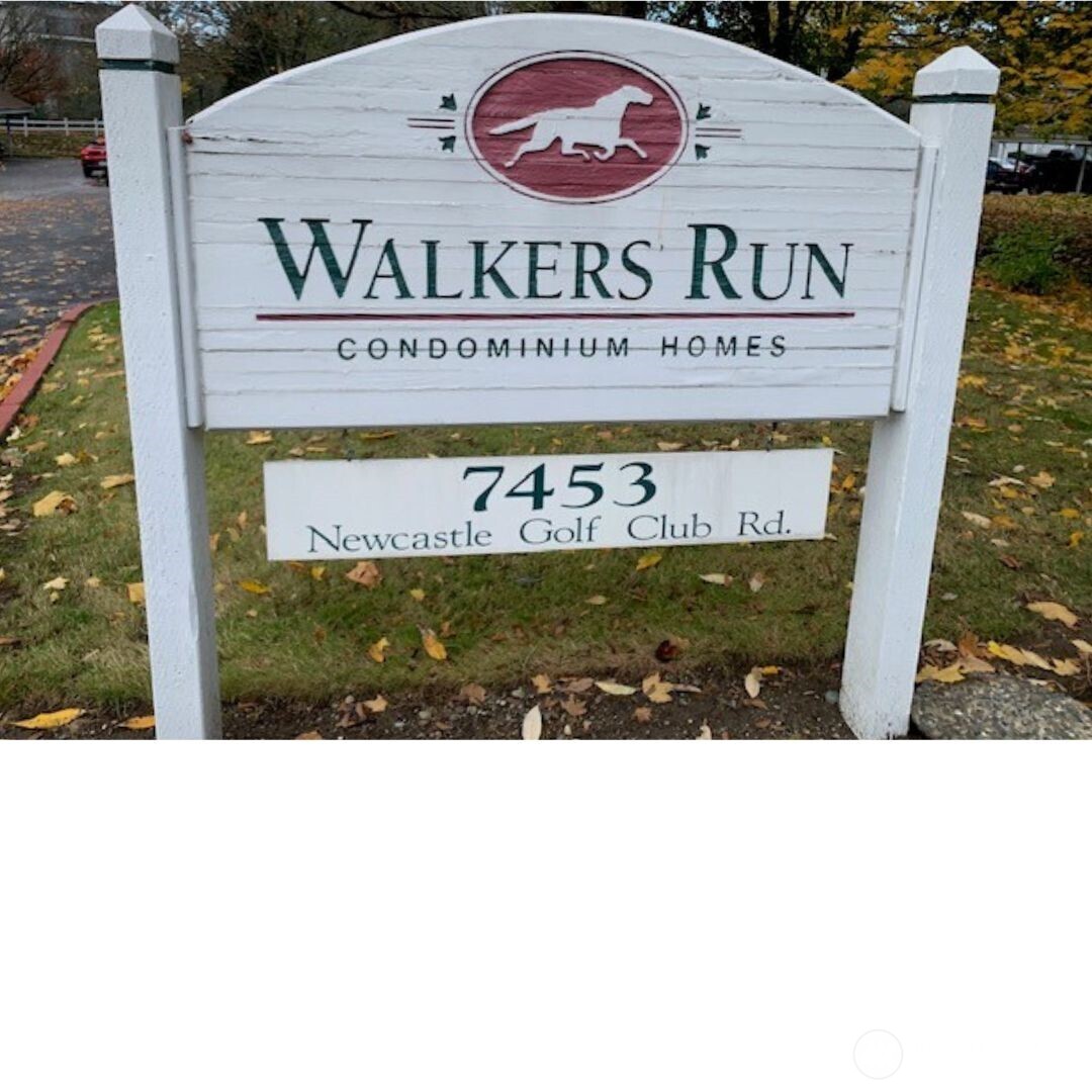 7453 Newcastle Golf Club Road, Unit A304 Newcastle, WA 98059 - Photo 17 of 19 a sign on the side of a building