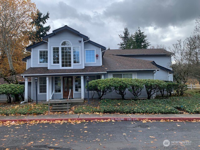 7453 Newcastle Golf Club Road, Unit A304 Newcastle, WA 98059 - Photo 19 of 19 a front view of a house with a yard and potted plants