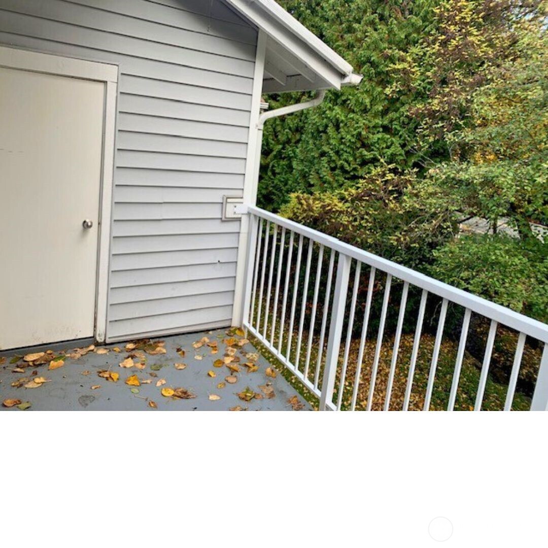 7453 Newcastle Golf Club Road, Unit A304 Newcastle, WA 98059 - Photo 4 of 19 a black and white photo of a backyard