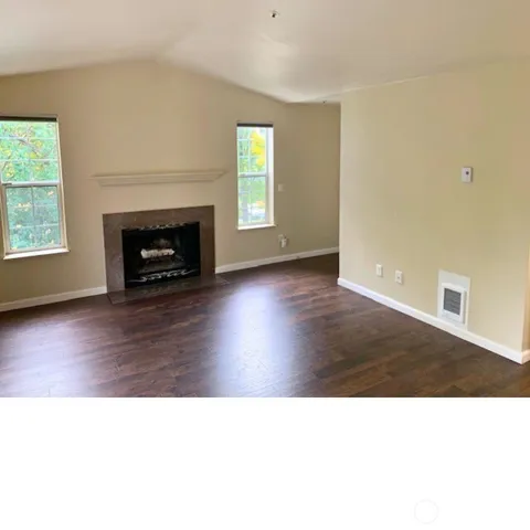a black and white photo of a living room