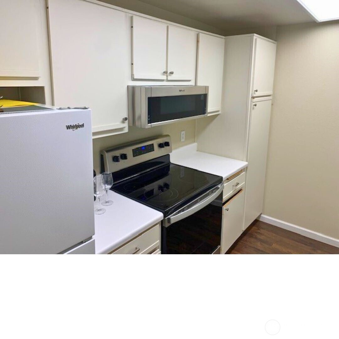 7453 Newcastle Golf Club Road, Unit A304 Newcastle, WA 98059 - Photo 9 of 19 a kitchen with a sink stove and microwave