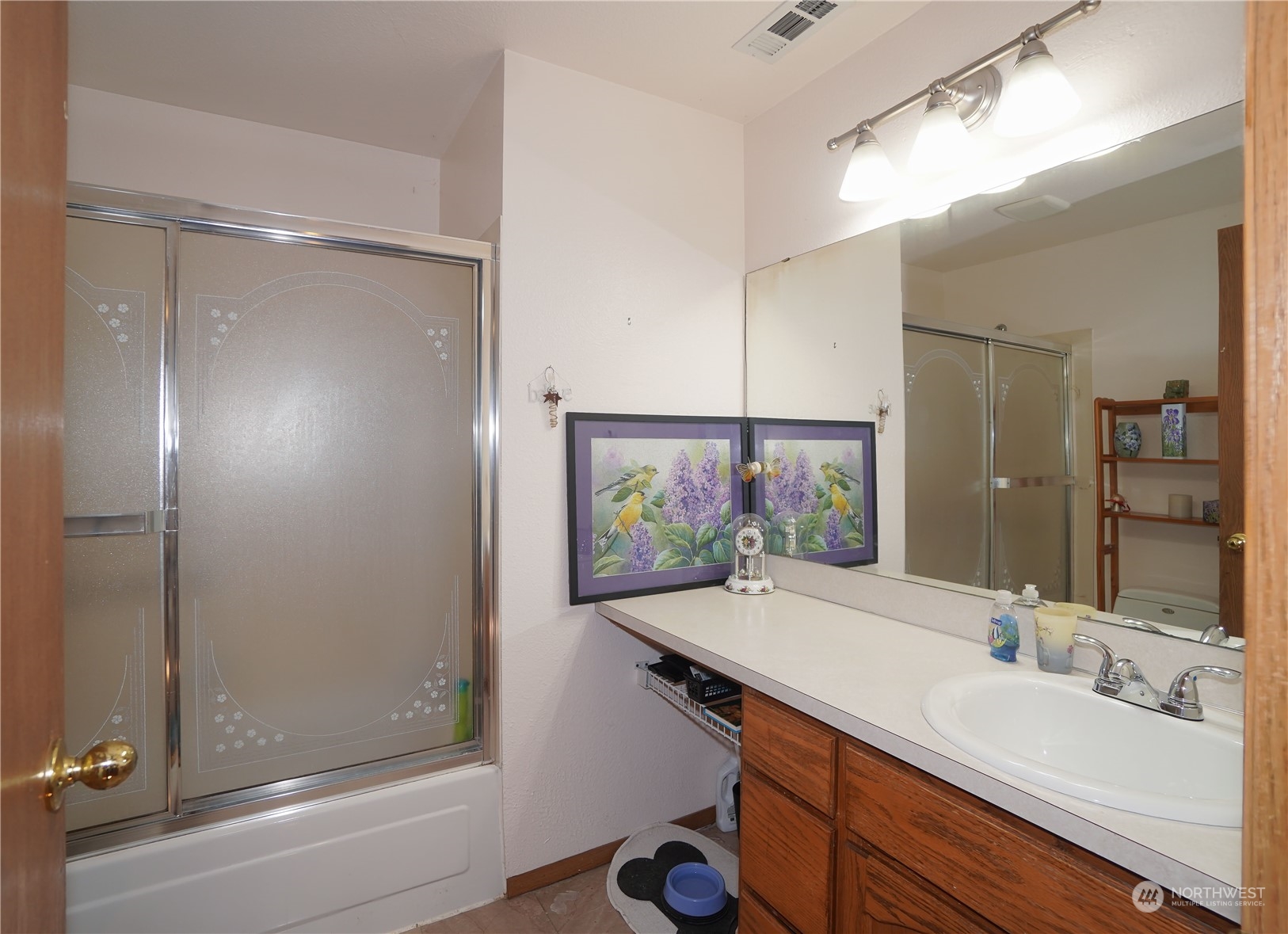 11209 Southeast 267th Place Kent, WA 98030 - Photo 16 of 31 a bathroom with a sink mirror and a shower