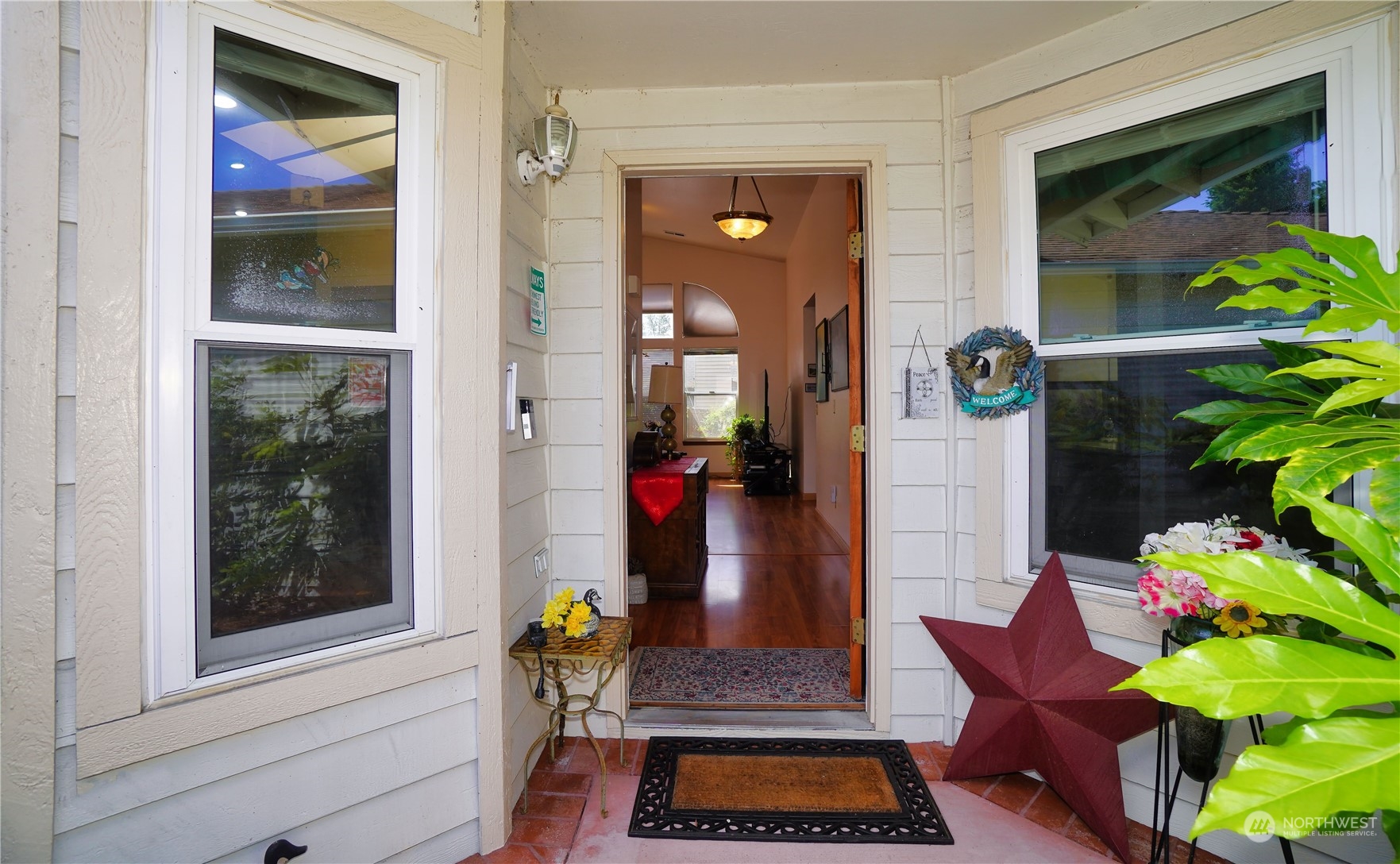 11209 Southeast 267th Place Kent, WA 98030 - Photo 2 of 31 view of living room with furniture and flowers