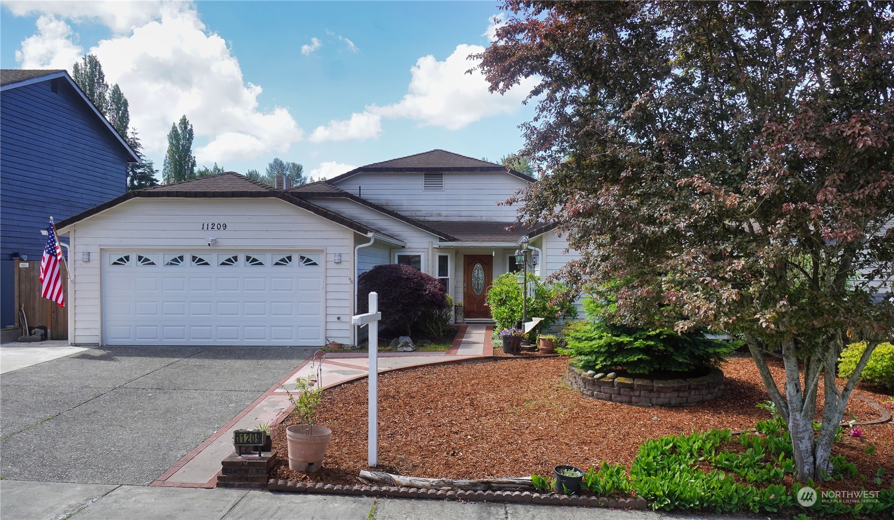 11209 Southeast 267th Place Kent, WA 98030 - Photo 21 of 31 a front view of a house with garden