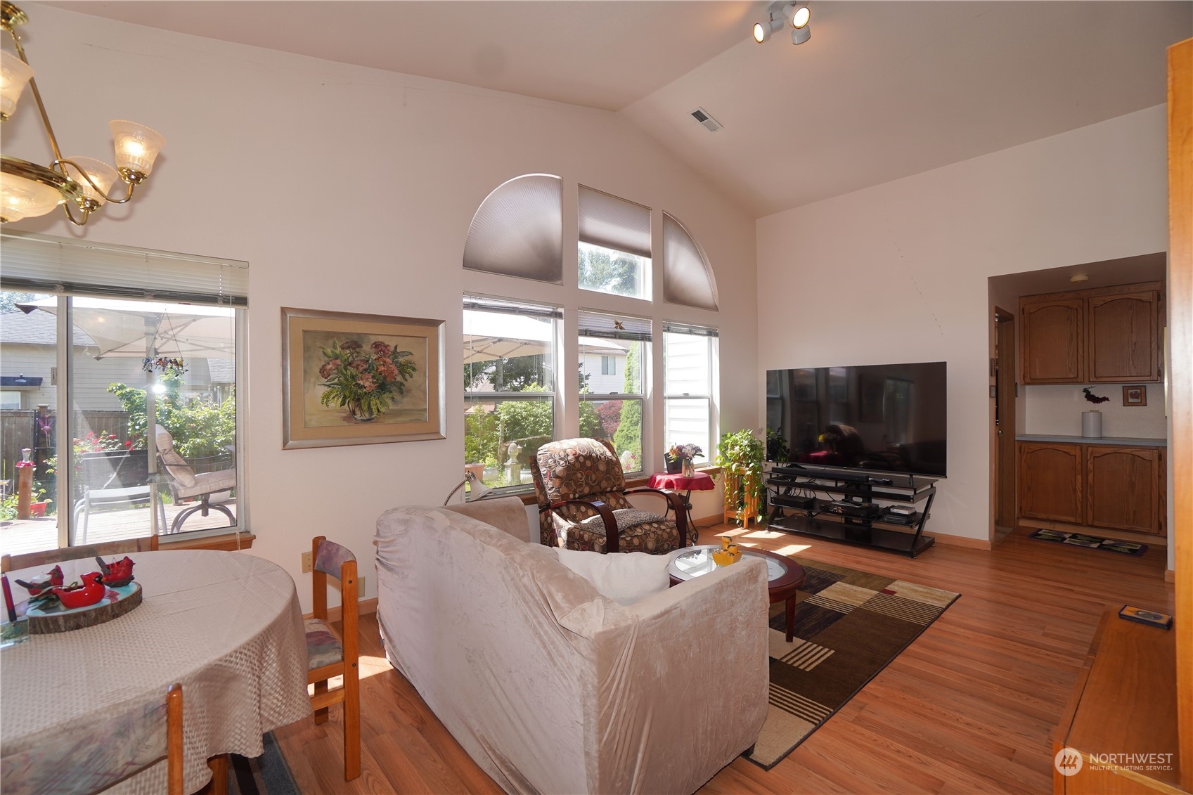 11209 Southeast 267th Place Kent, WA 98030 - Photo 5 of 31 a living room with furniture and a flat screen tv