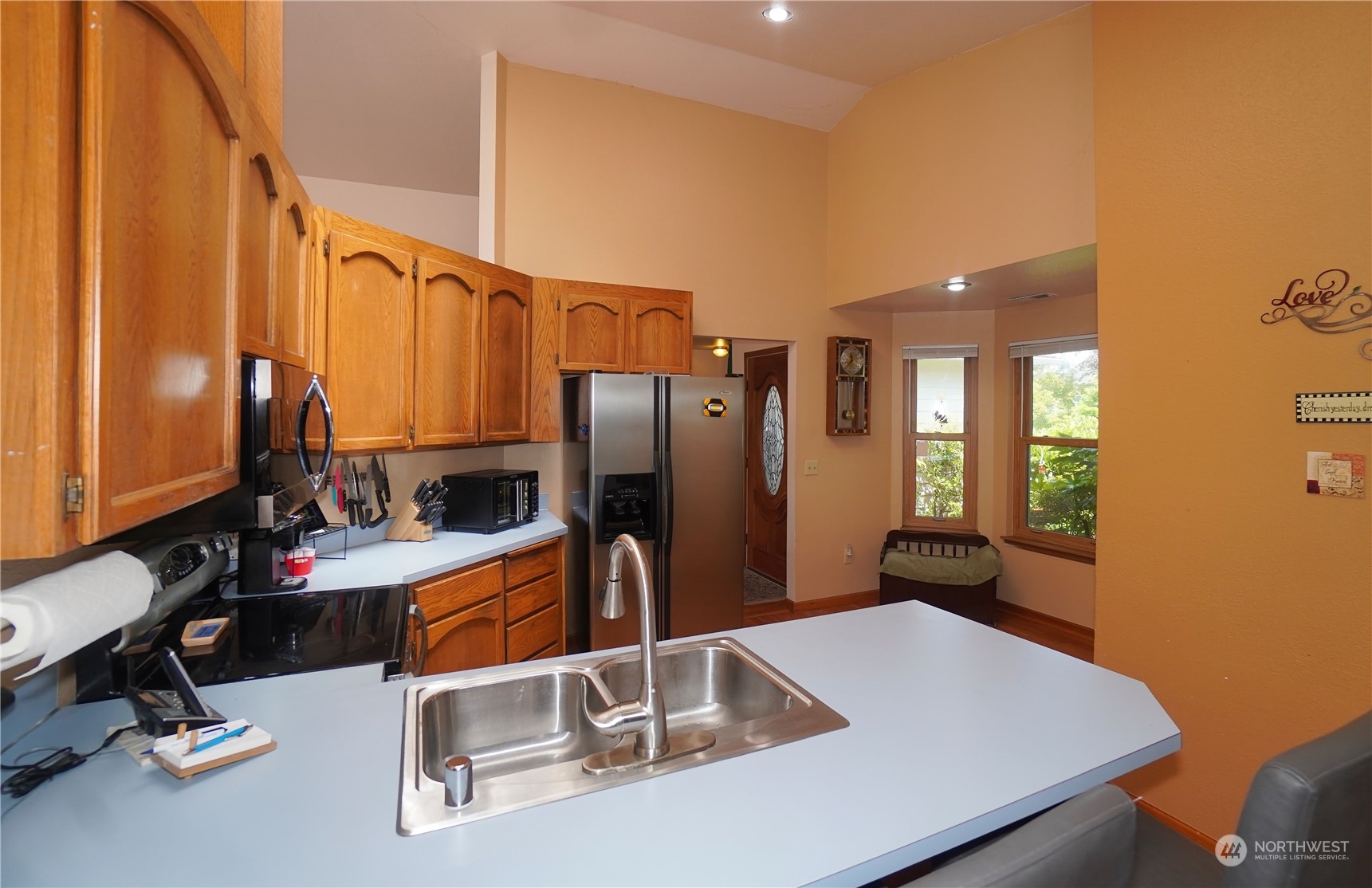 11209 Southeast 267th Place Kent, WA 98030 - Photo 9 of 31 a kitchen with stainless steel appliances a sink and a refrigerator