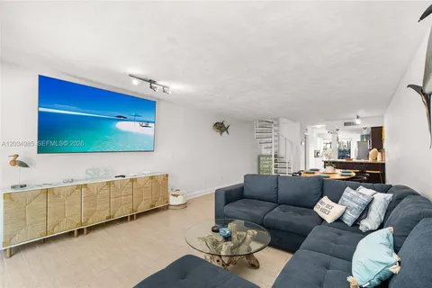a kitchen with stainless steel appliances granite countertop a stove a refrigerator and a sink