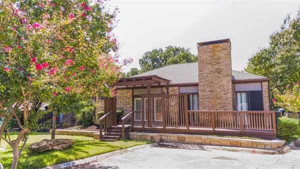 a house with a tree in front of it