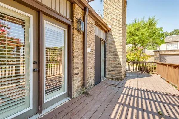 a view of balcony with wooden floor
