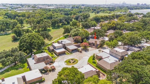 an aerial view of residential house with outdoor space and swimming pool