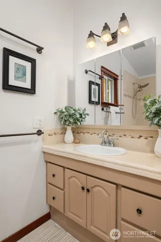a utility room with sink dryer and washer