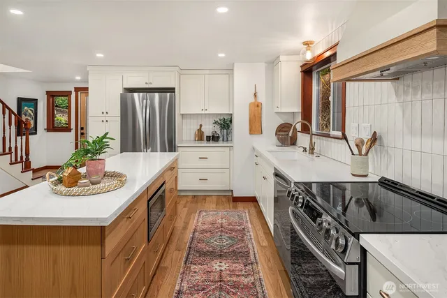 a kitchen with a sink stove and refrigerator