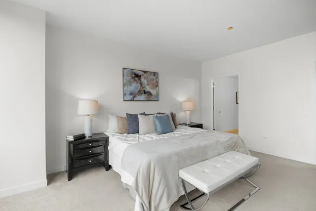 a spacious bathroom with a bathtub shower sink double and mirror