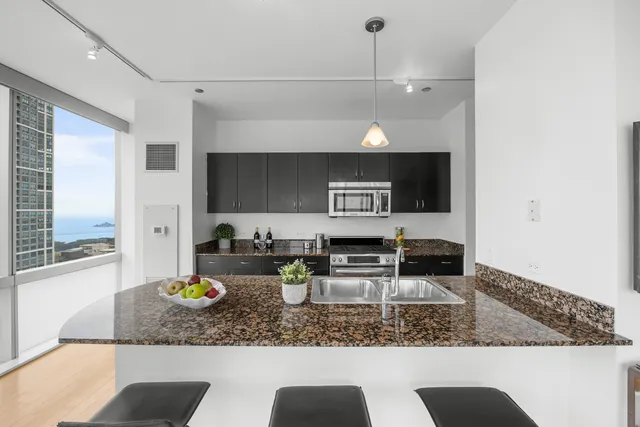 a kitchen with granite countertop lots of counter top space