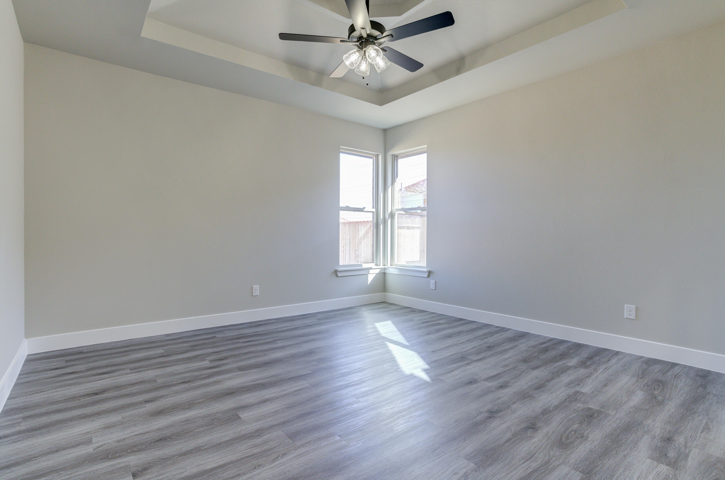 6928 12th Street Lubbock, TX 79416 - Photo 24 of 50 wooden floor in an empty room with a window