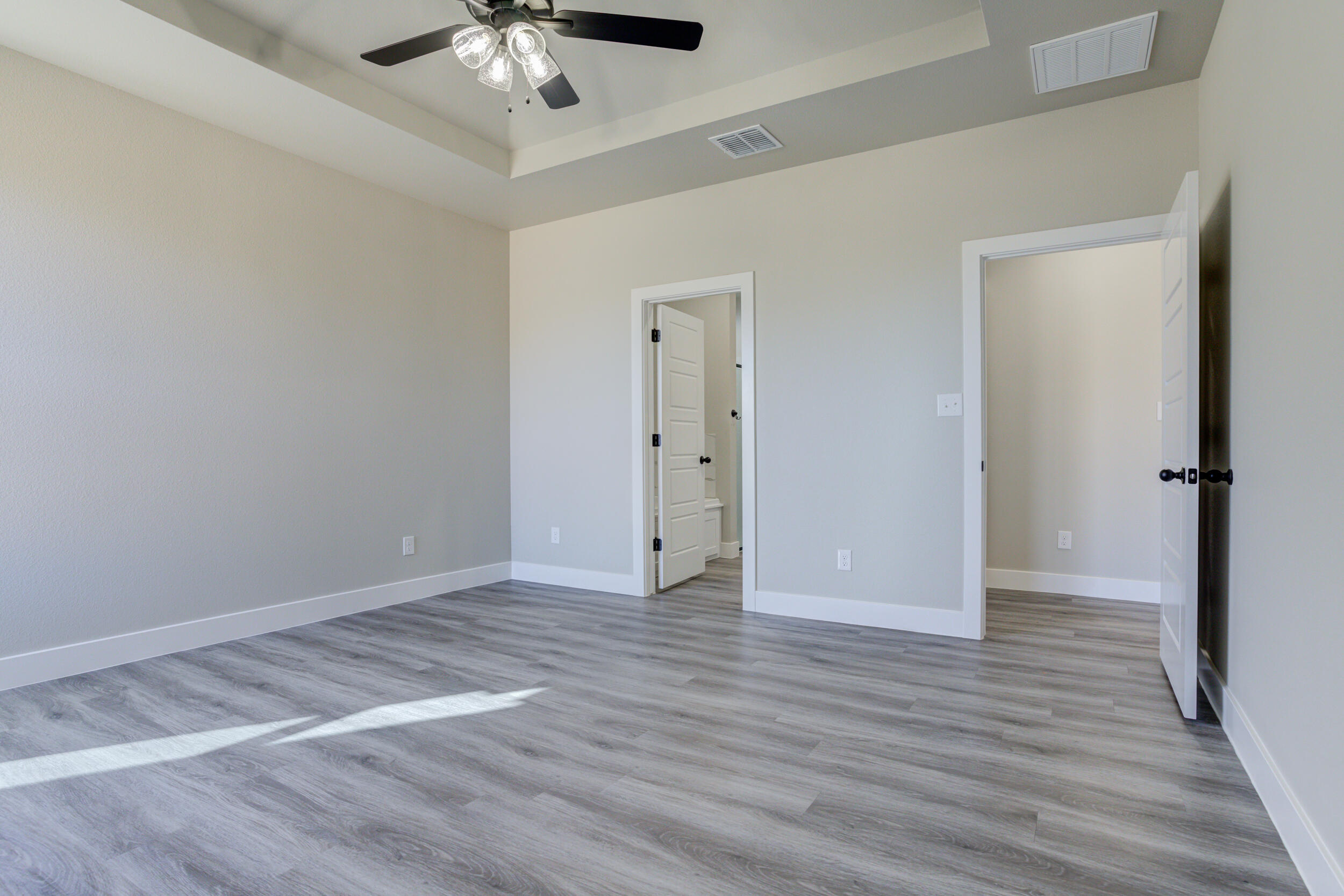 6928 12th Street Lubbock, TX 79416 - Photo 25 of 50 a view of an empty room with wooden floor