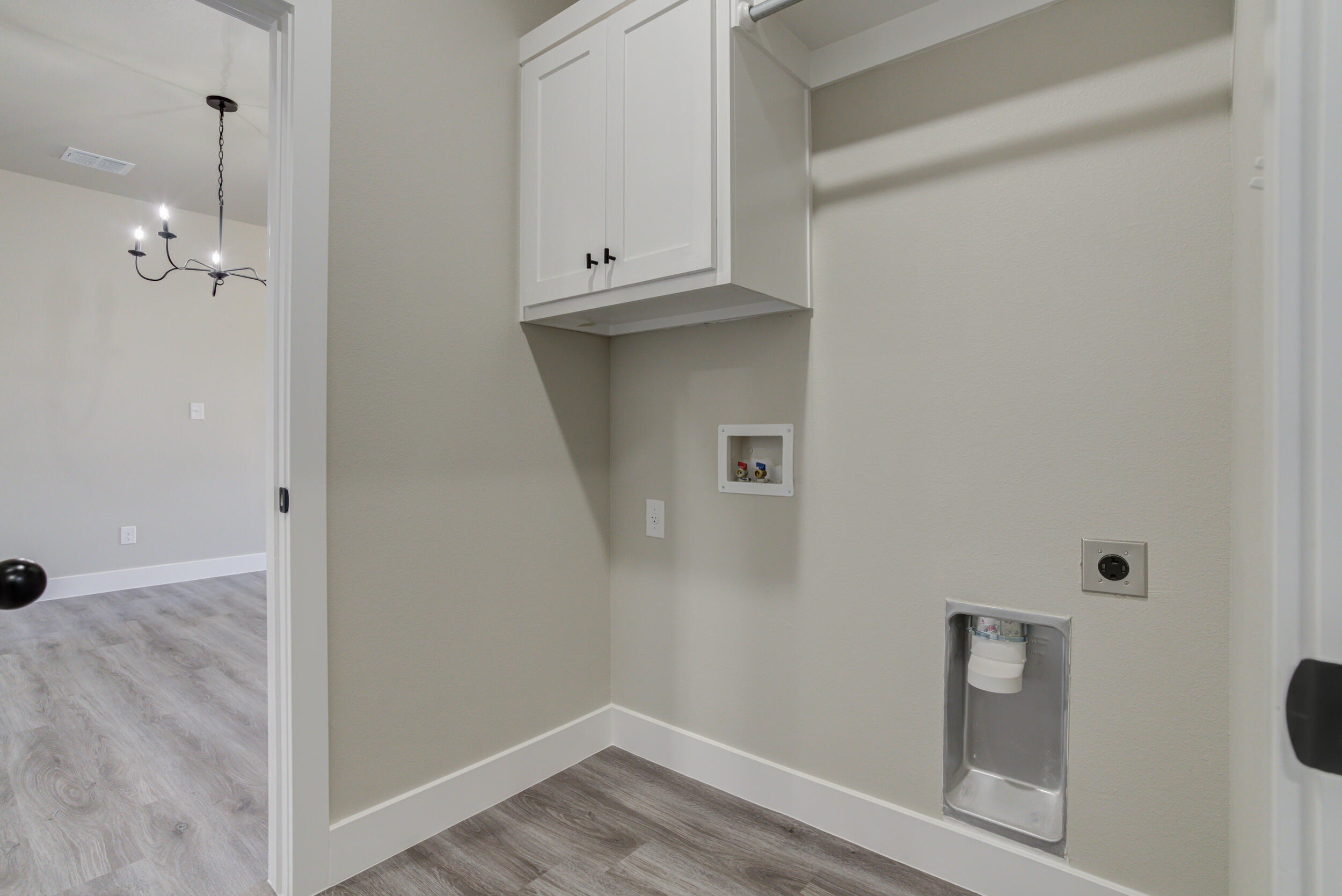6928 12th Street Lubbock, TX 79416 - Photo 36 of 50 a view of an empty room with wooden floor and closet