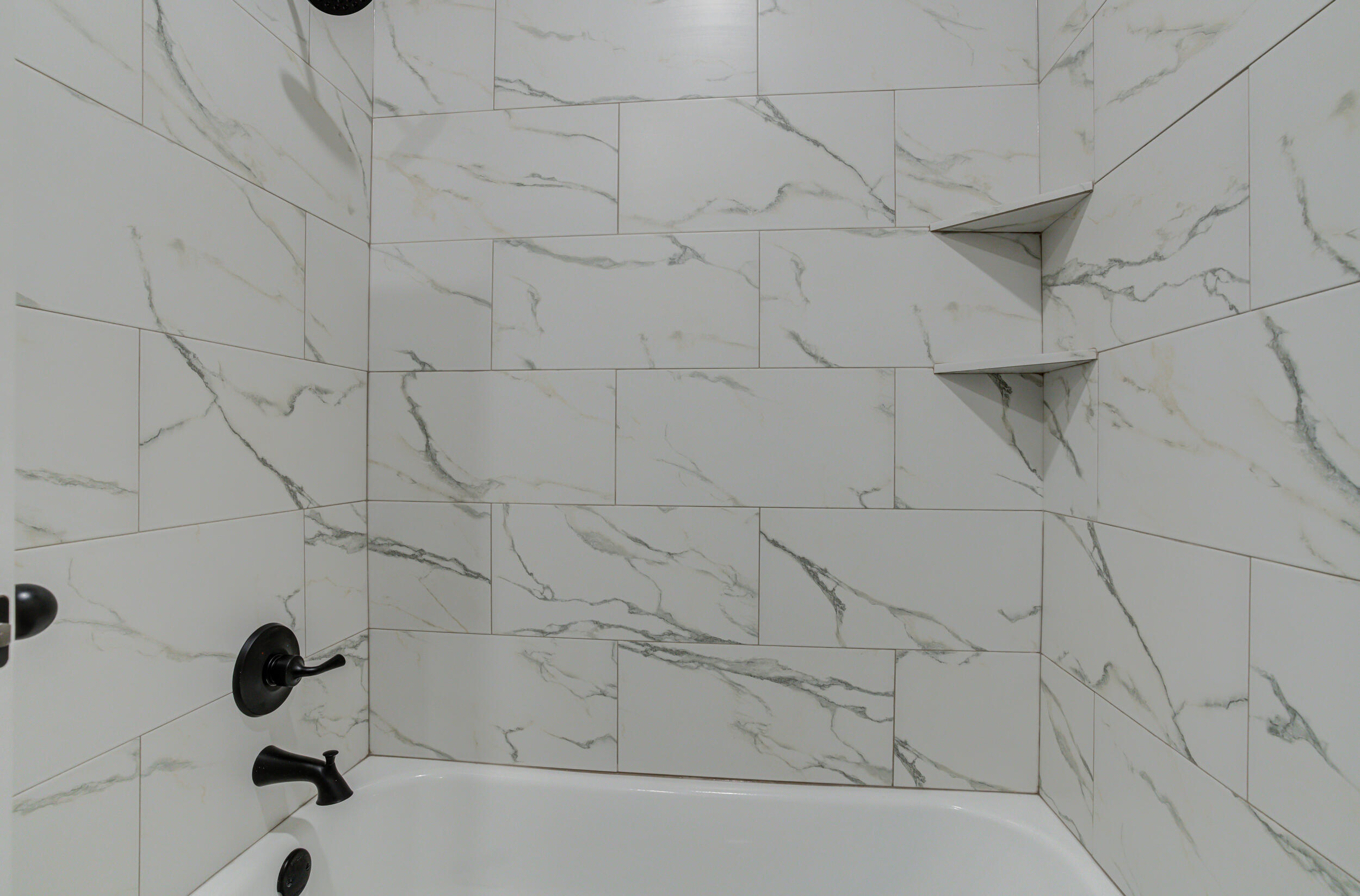 6928 12th Street Lubbock, TX 79416 - Photo 45 of 50 a bathroom with a bathtub