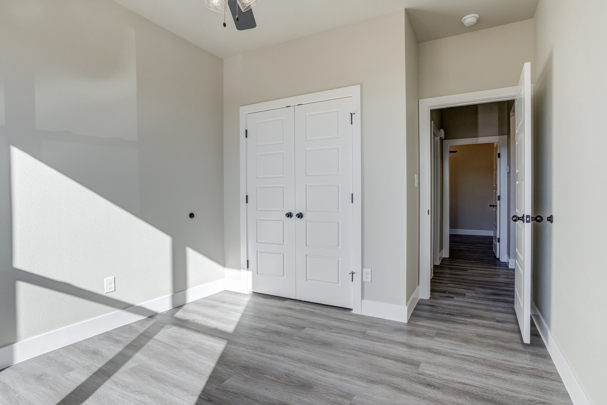 6928 12th Street Lubbock, TX 79416 - Photo 47 of 50 a view of a hallway with wooden floor and staircase