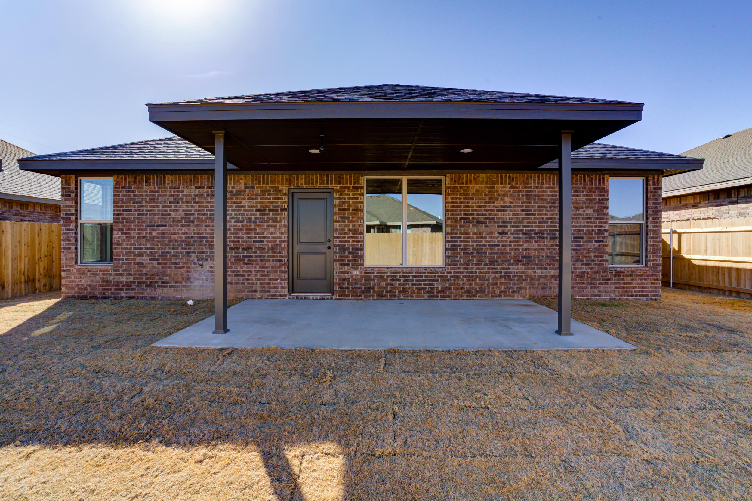 6928 12th Street Lubbock, TX 79416 - Photo 49 of 50 a view of a wooden house with a small yard