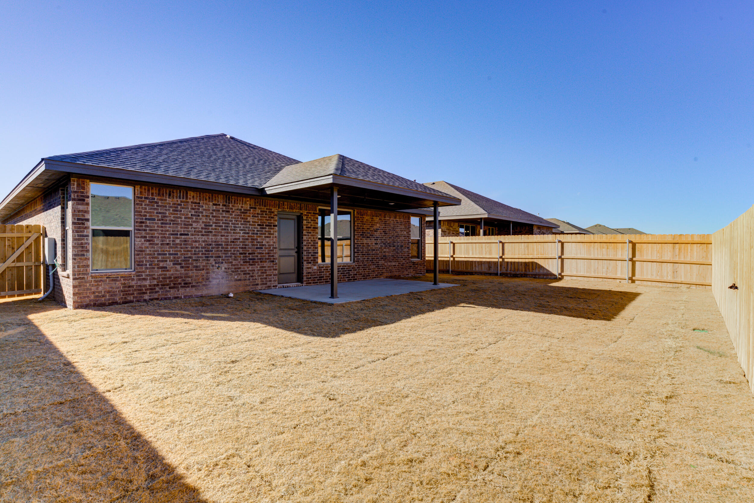 6928 12th Street Lubbock, TX 79416 - Photo 50 of 50 a front view of a house with a yard